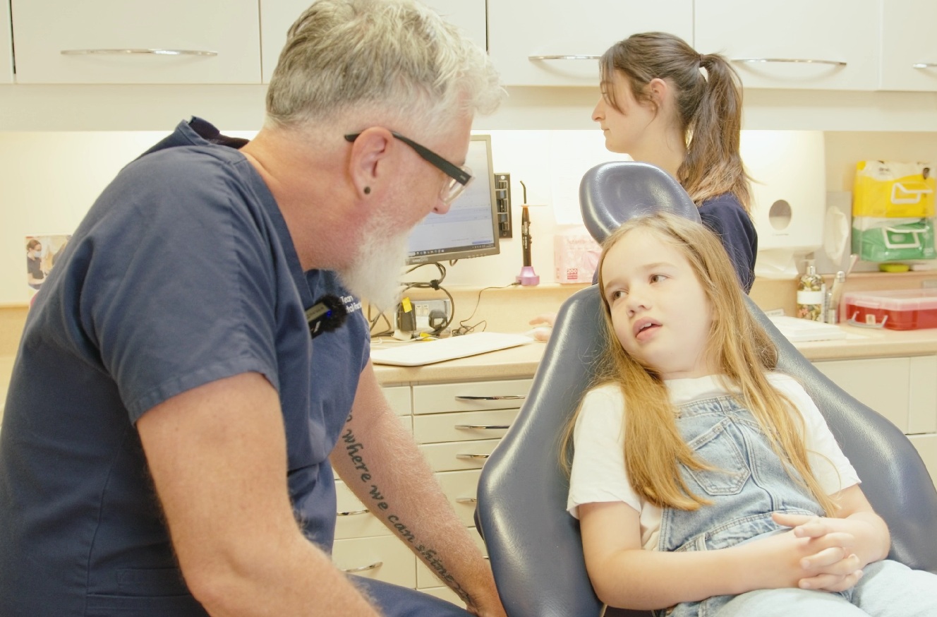 Dr Jean Du Plessis with a child